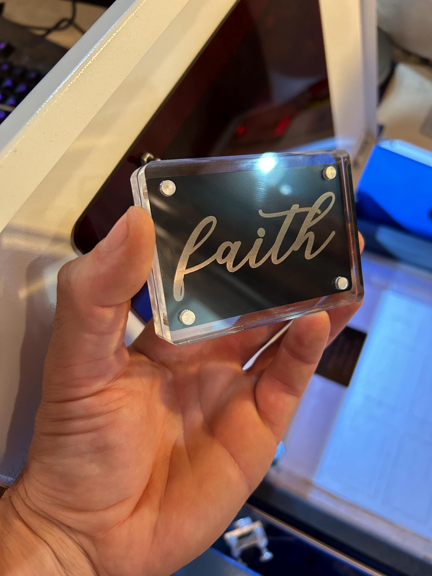Detailed shot of custom laser cut metal keepsake card engraved with “Faith” script text, Christian inspiration gift