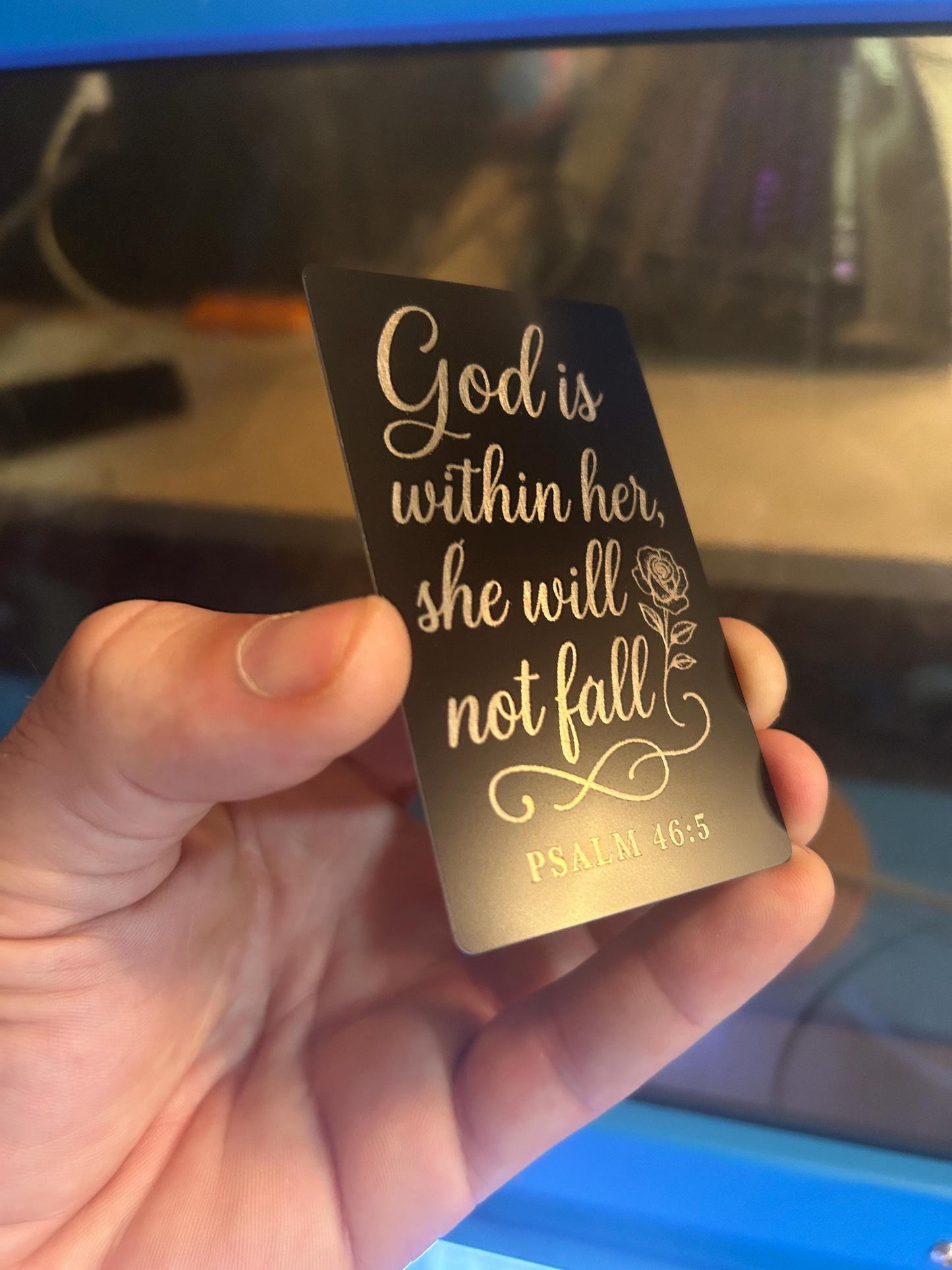 Laser engraved metal "God Is Within Her, She Will not Fall" quote with biblical reference in matte black/silver
