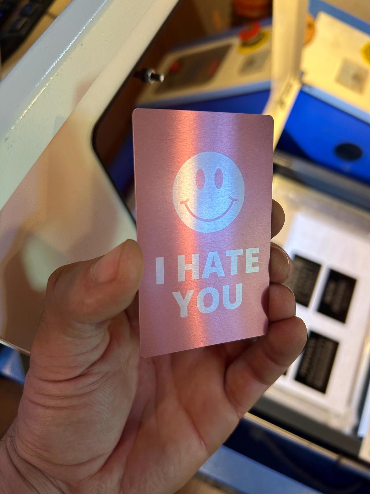 Custom metal business card with I hate you and smiley face