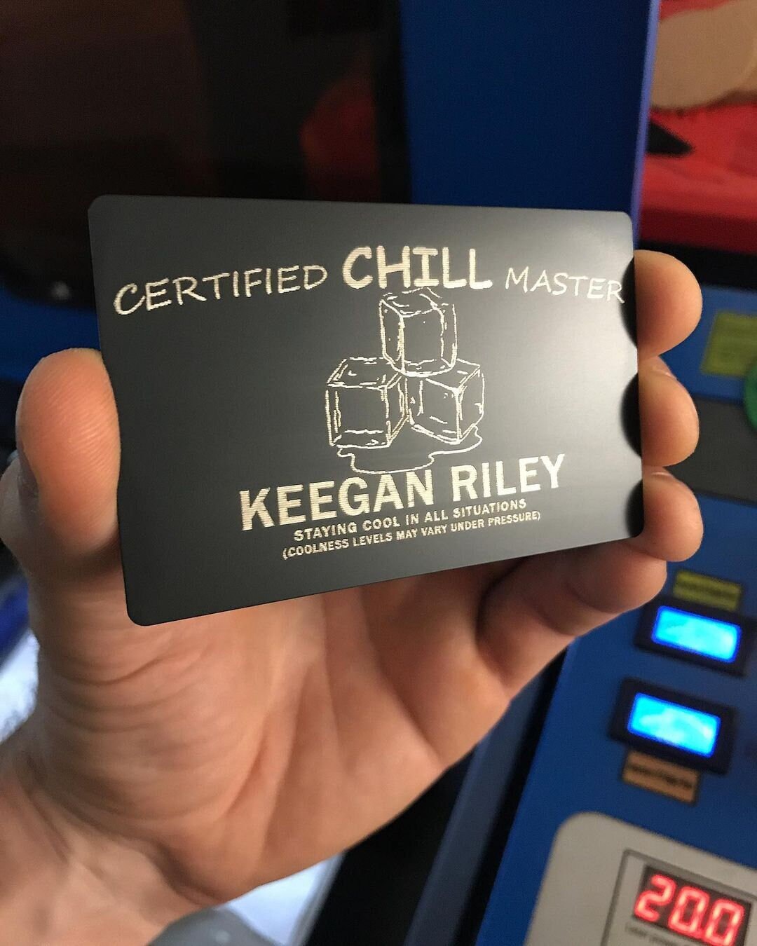 hand holding metal business card with certified chill master, ice cubes and personalized name engraving for a friendsgiving gag gift for all ages