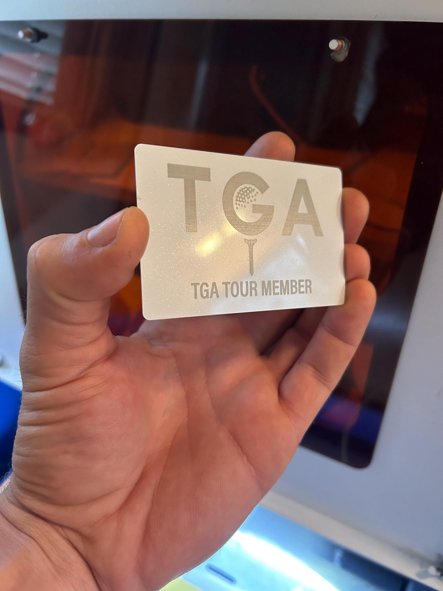 White and silver metal business card, with golf competition branding and VIP member pass for participants, laser engraved in anodized aluminum