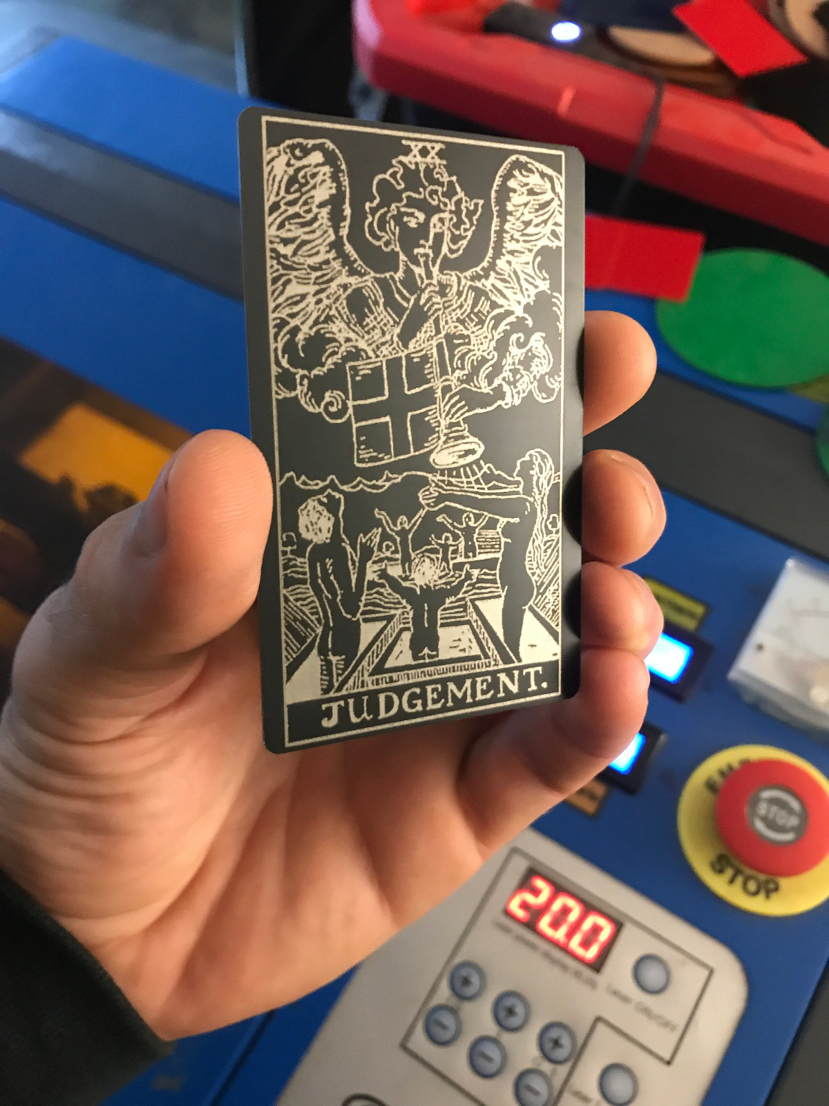 Metal tarot card titled Judgment