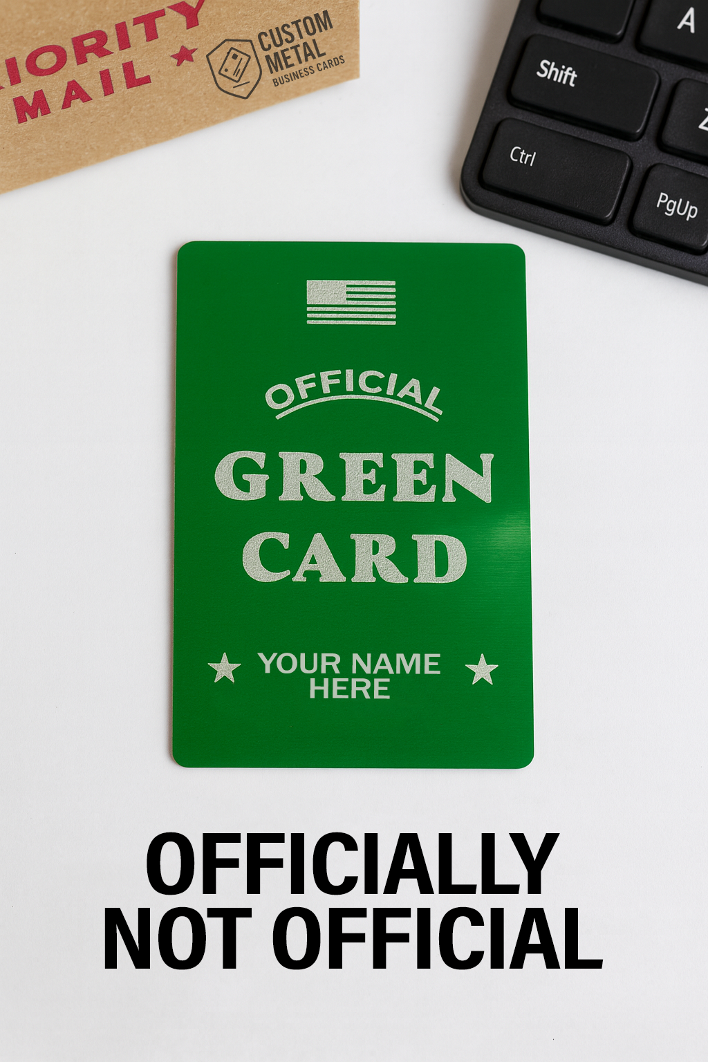 Green card mockup with 'Official Green Card' text on a white surface with keyboard and Priority Mail box.