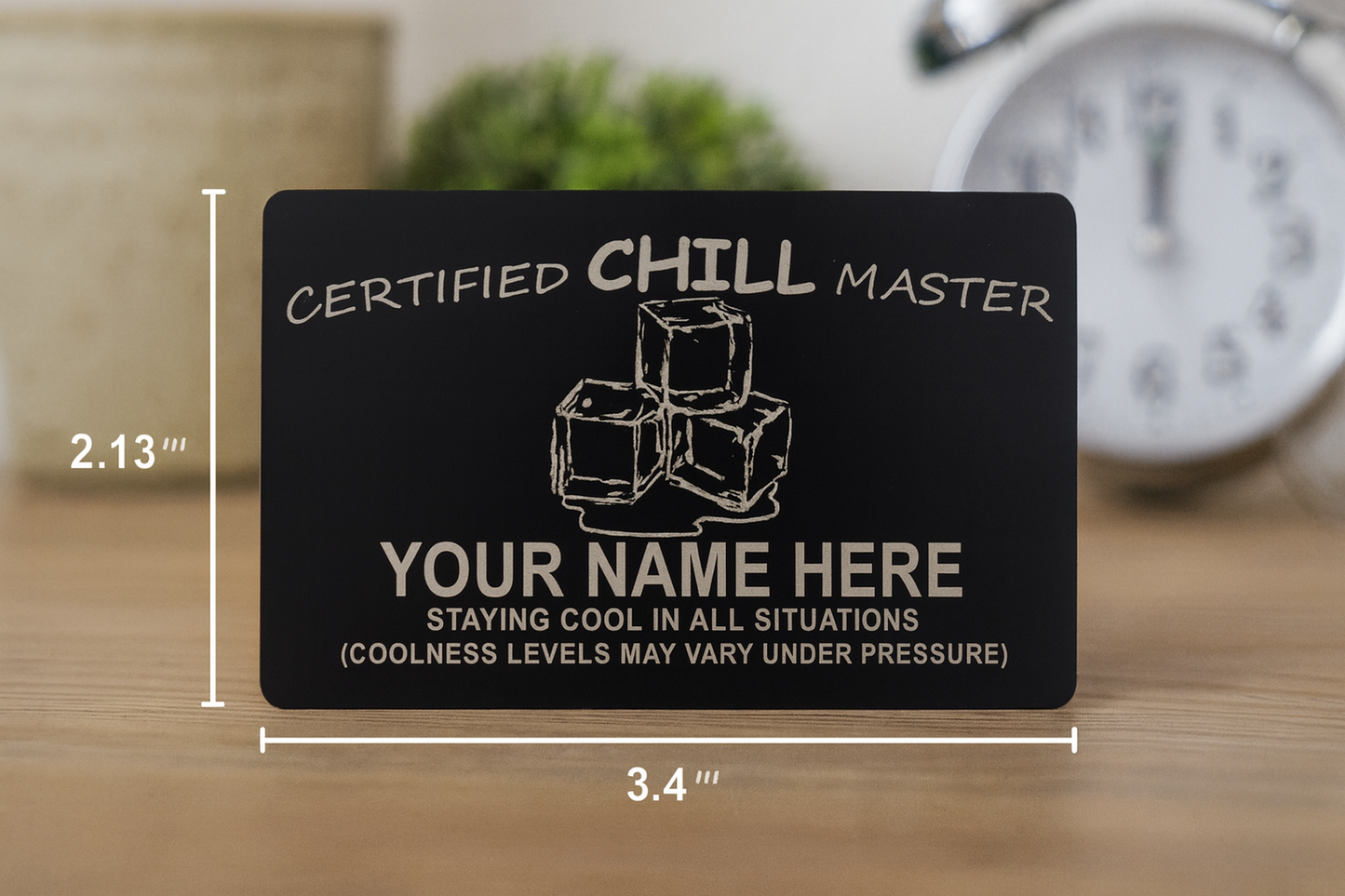 Black card with 'Certified Chill Master' text and ice cube graphics on a wooden surface.
