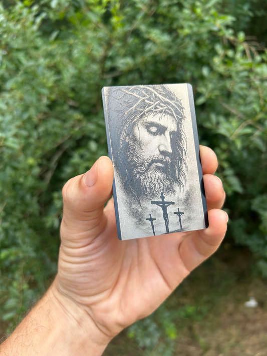 metal laser engraved bible bookmark illustration of jesus christ with crown of thorns and crosses crucifix depiction dedication religious faith inspired metal card on green background