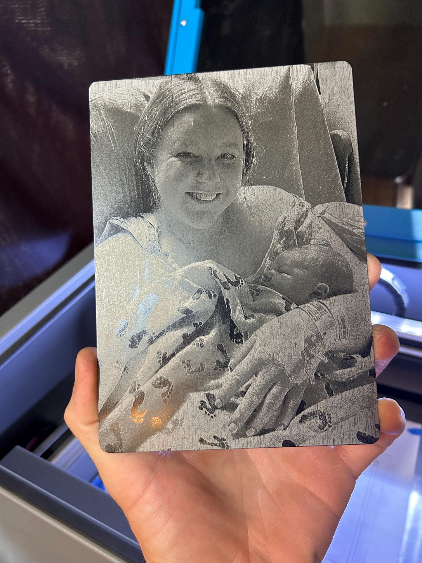Laser engraved metal placard of mother with newborn baby