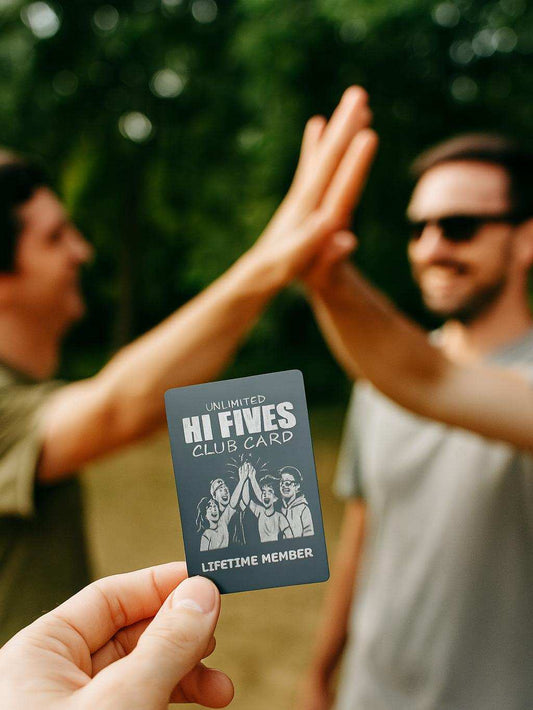 Hand holding a 'Hi Fives Club Card' with two people giving high fives in the background.