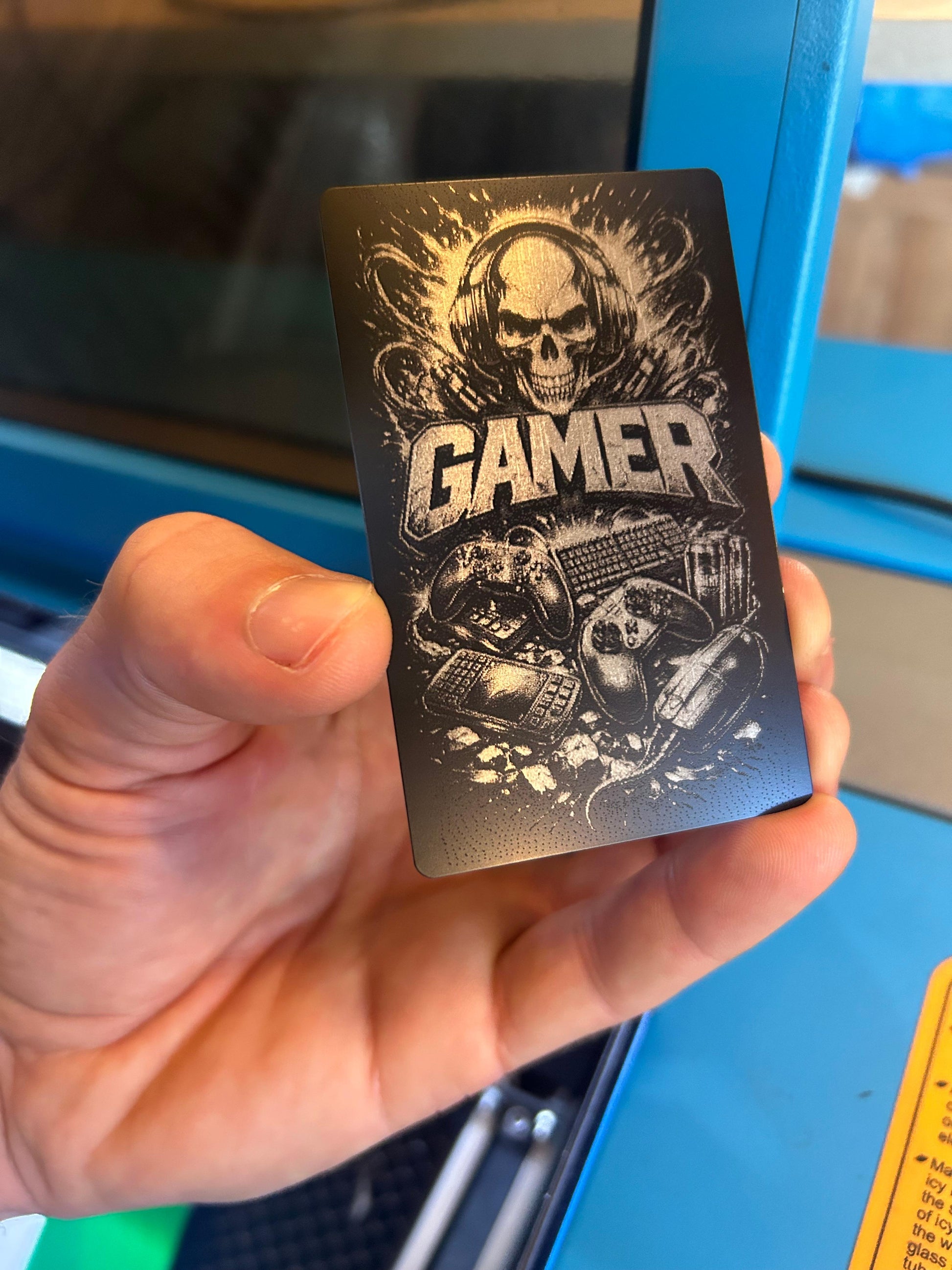 Wallet-sized gamer identification card with detailed graphic engraving