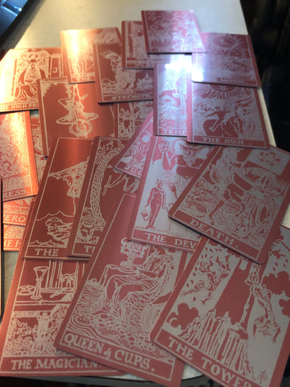array of laser engraved rose gold metal tarot cards