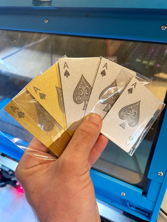Set of gold and silver laser engraved metal Ace of Spades cards