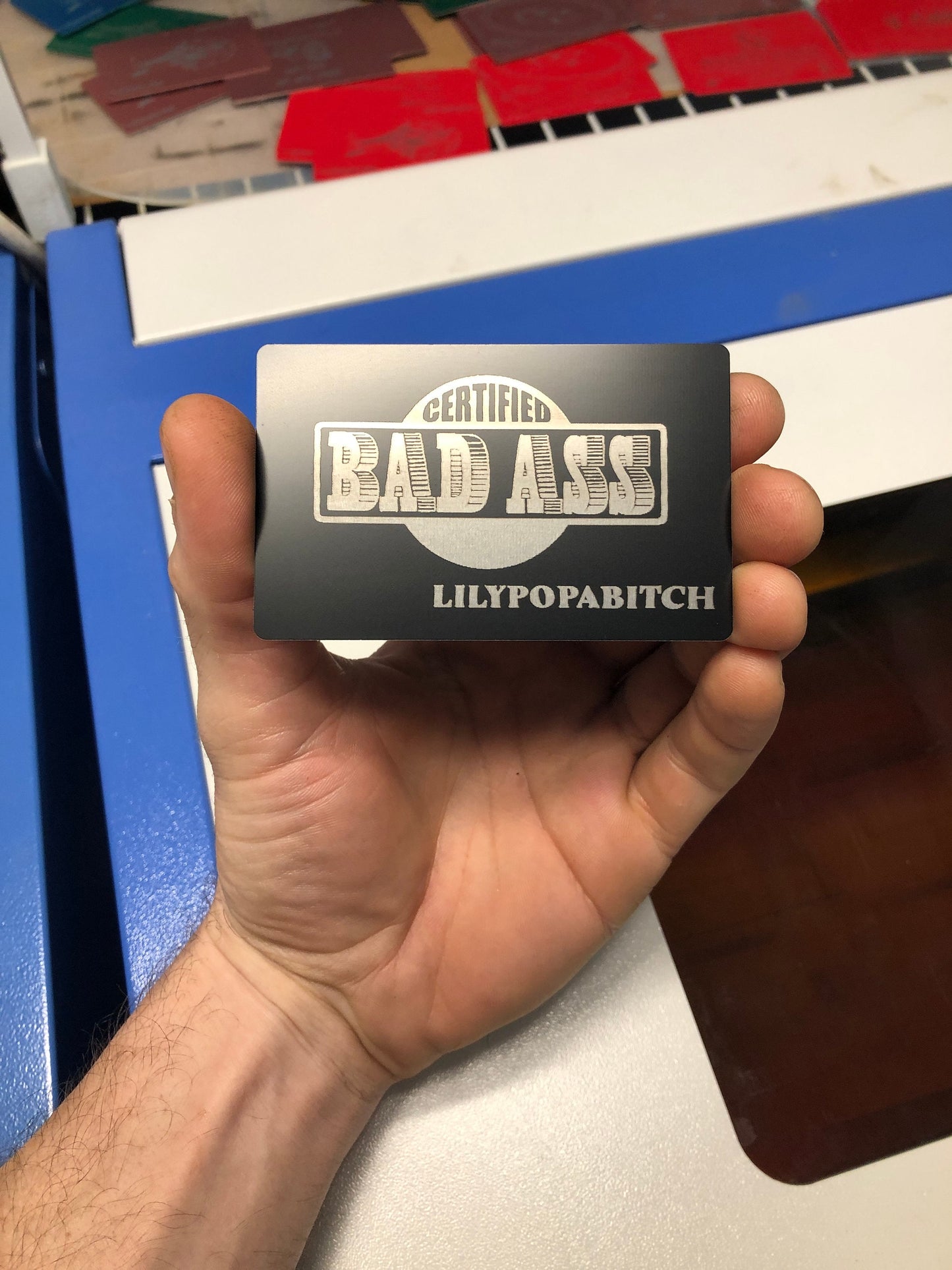 Metal Certified Bad-Ass identification badge with personalized laser engraved text below.