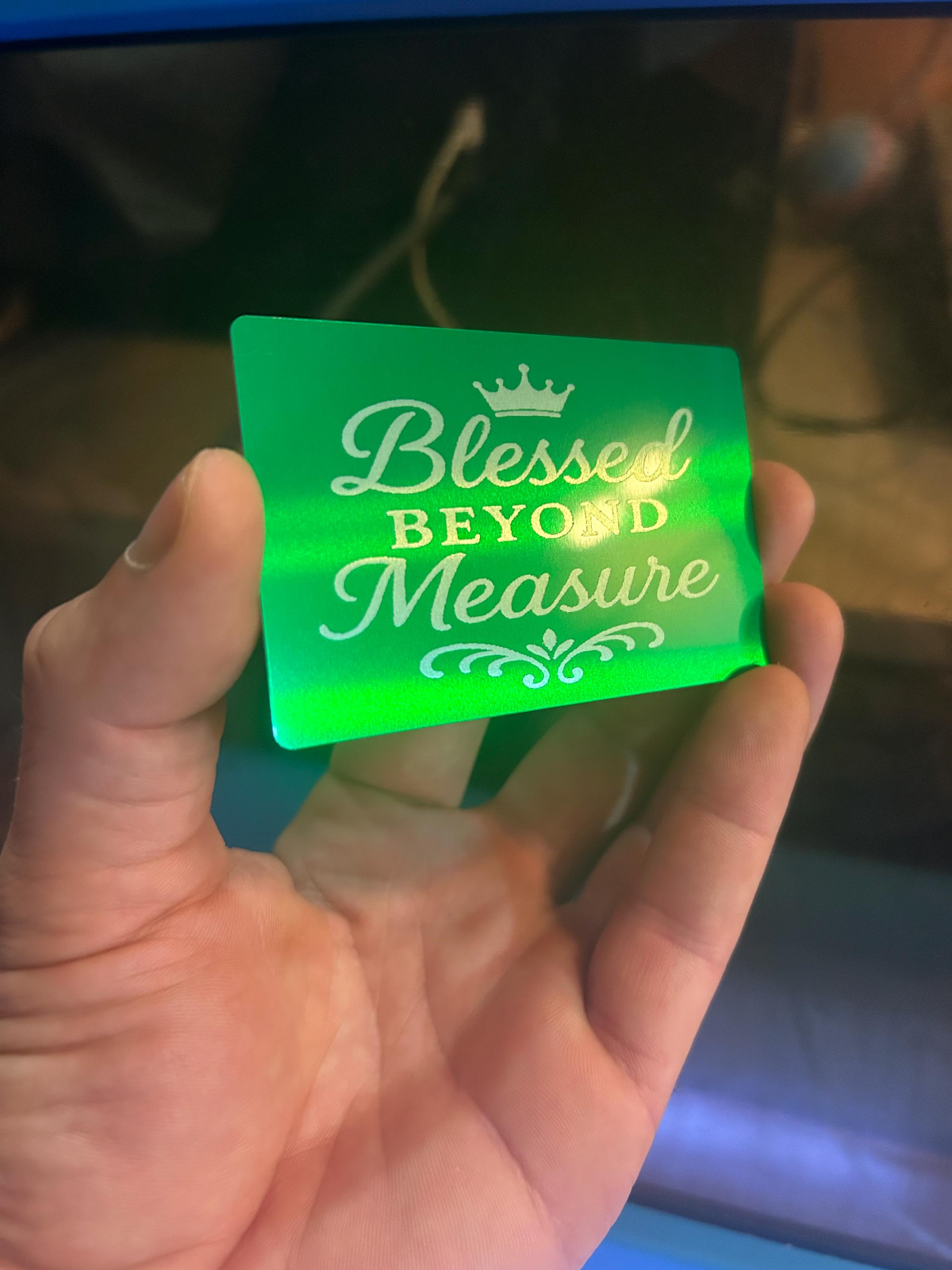 Metal keepsake card with 'Blessed Beyond Measure' engraving