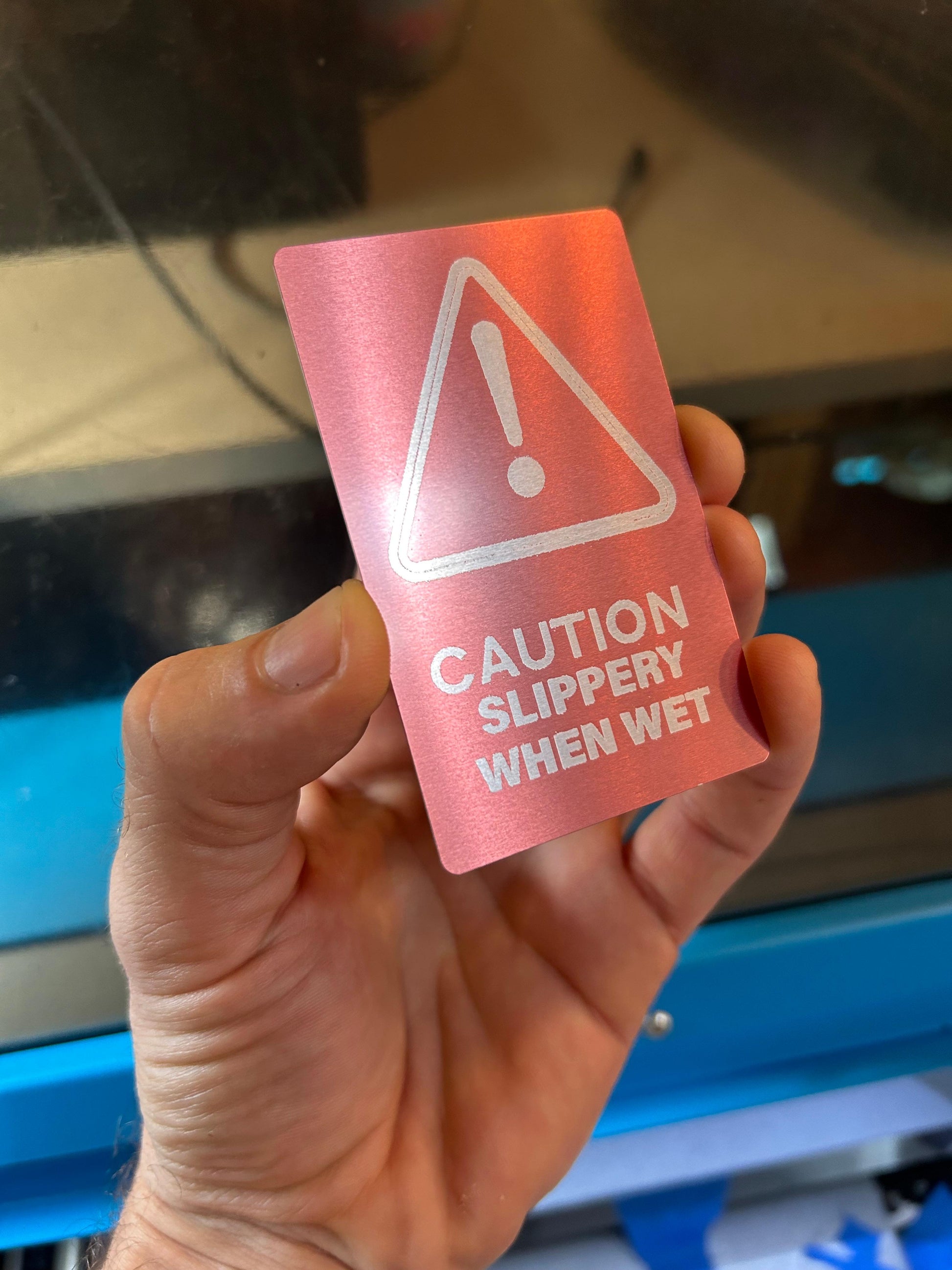 Metal "Slippery When Wet" laser engraved caution sign