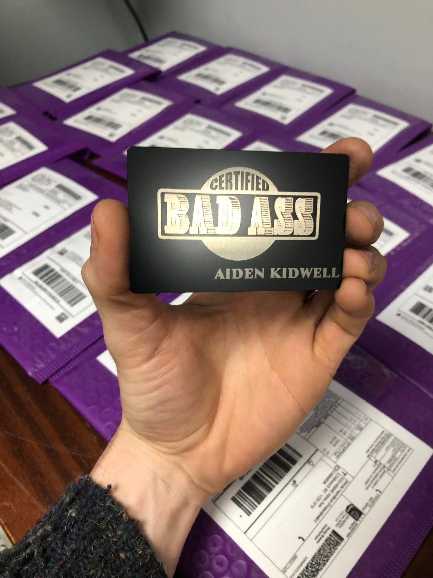 Laser engraved metal Certified Bad Ass card in black/silver with personalized name engraving