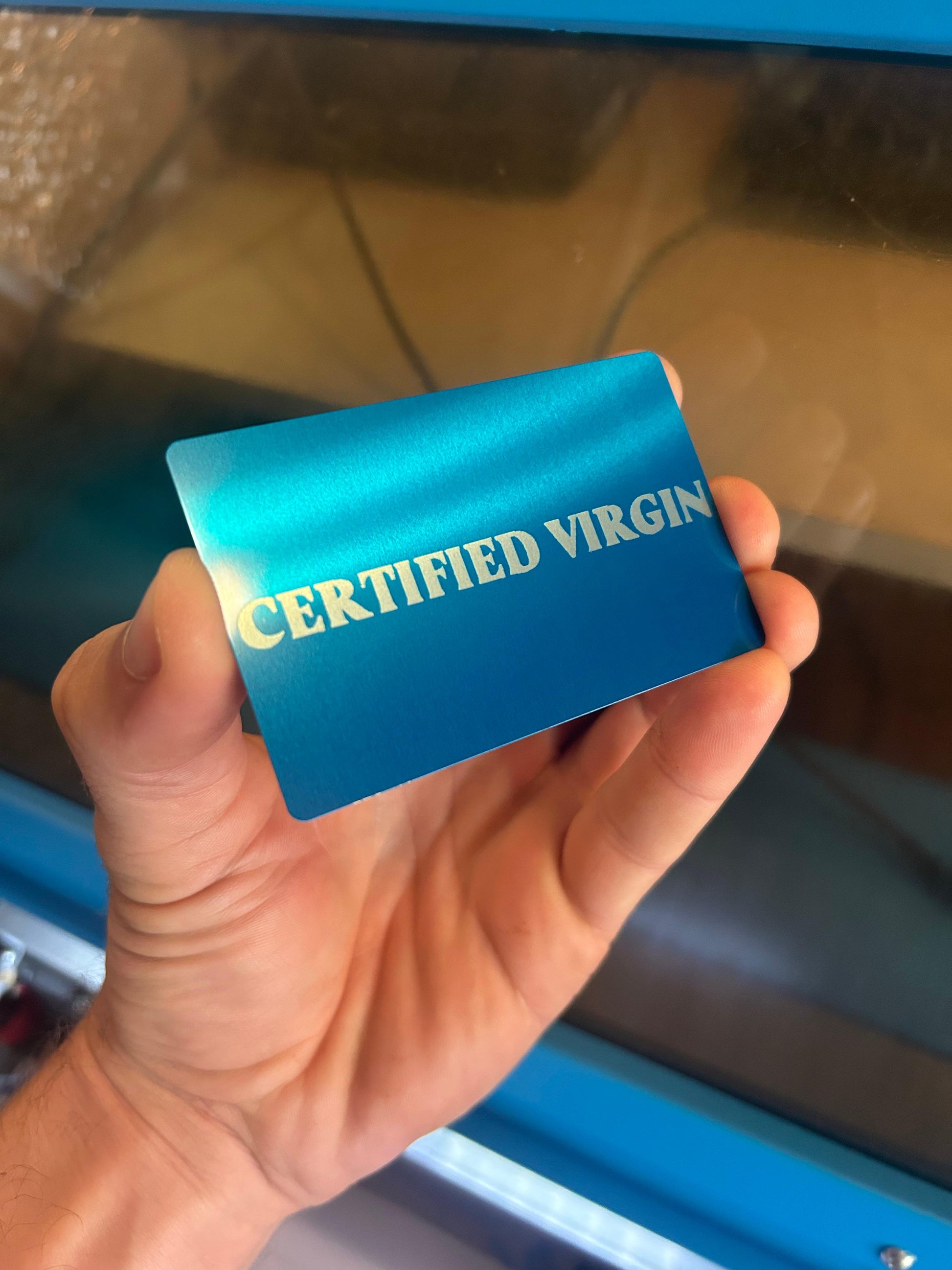 Laser engraved metal Certified Virgin gag gift card in blue/silver