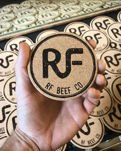 Laser engraved cork coaster with restaurant branding