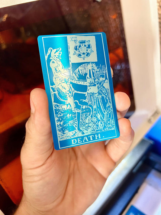 Metal tarot card in blue/silver anodized aluminum with "Death" design laser engraving