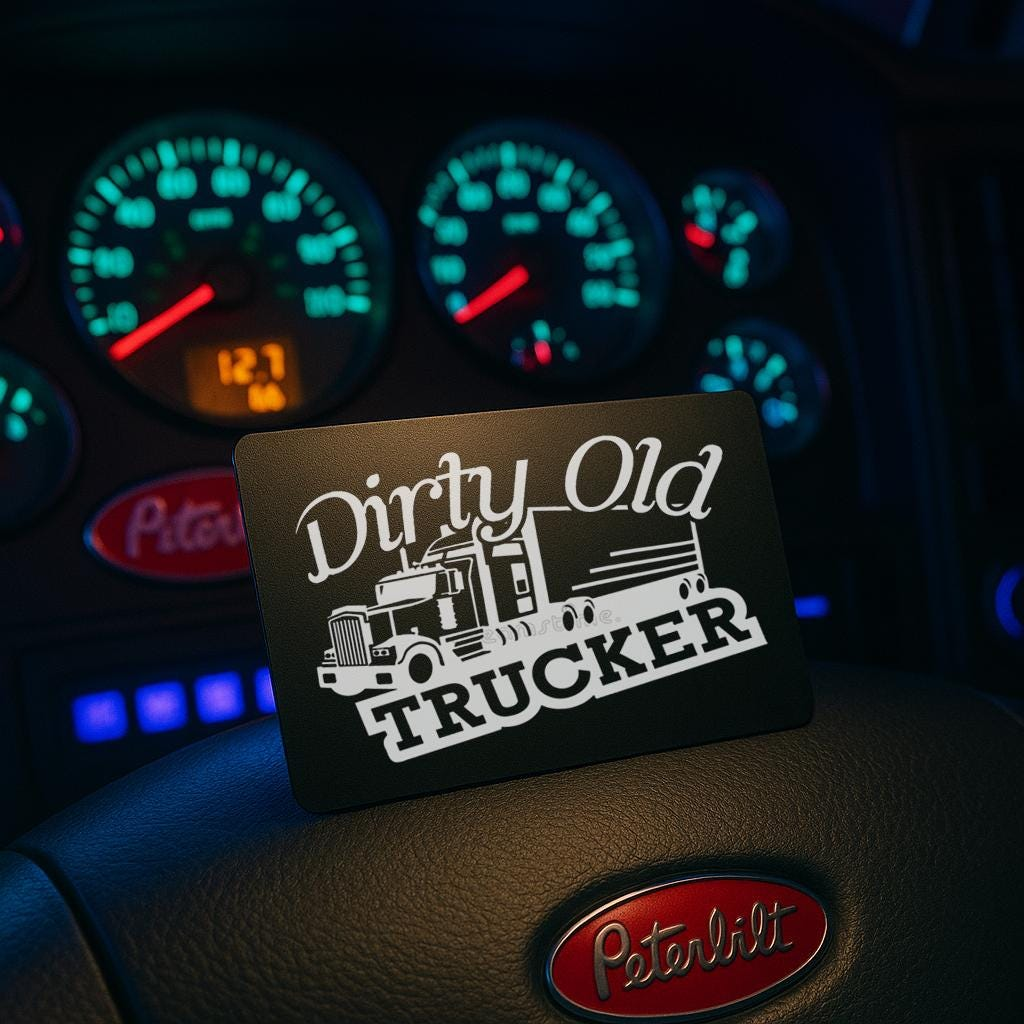 Metal Keepsake with 'Dirty Old Trucker' design engraved on a vehicle dashboard with Peterbilt logo.