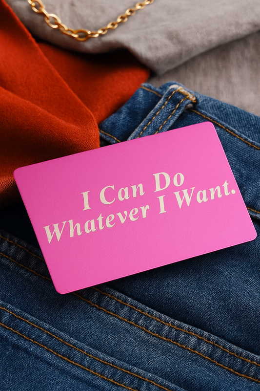 Purple/silver metal card with 'I Can Do Whatever I Want' text on blue jeans