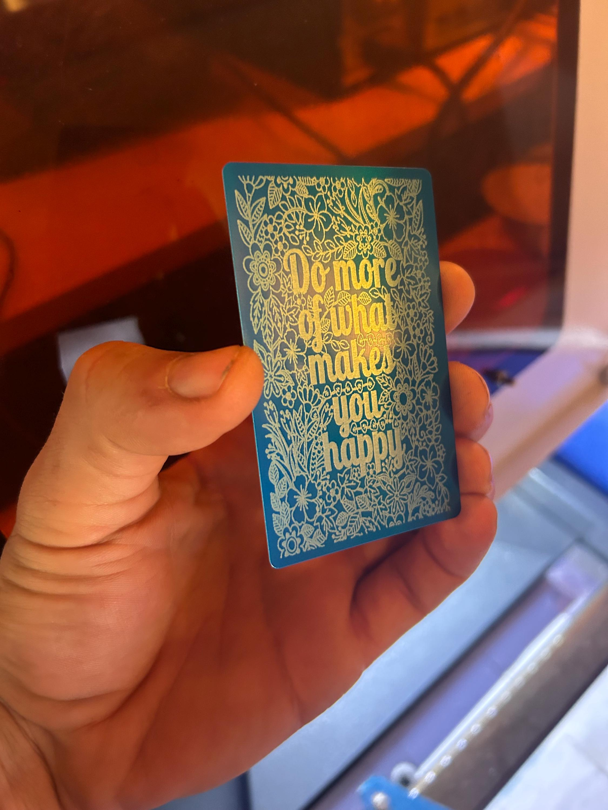 Blue metal inspirational card with silver motivational text
