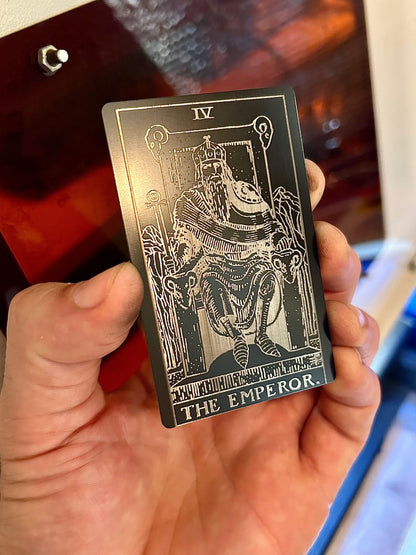 Laser engraved metal tarot card with The Emperor artwork in black/silver anodized aluminum