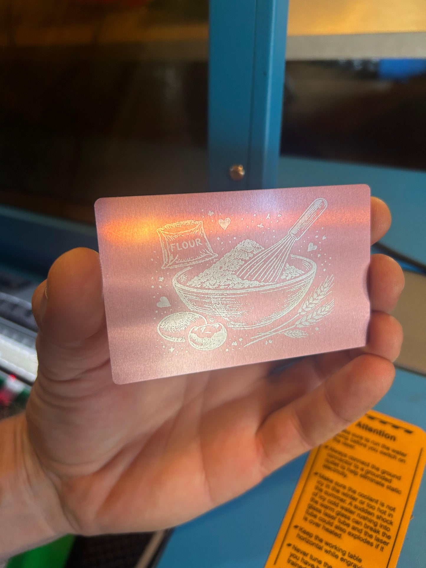 Metal rose gold artwork with flour and whisk