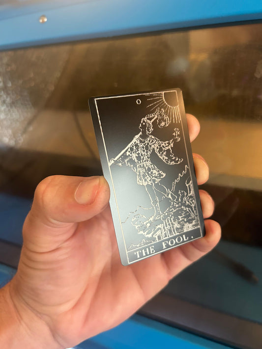 Laser engraved metal Tarot Card with The Fool artwork in black/silver anodized aluminum