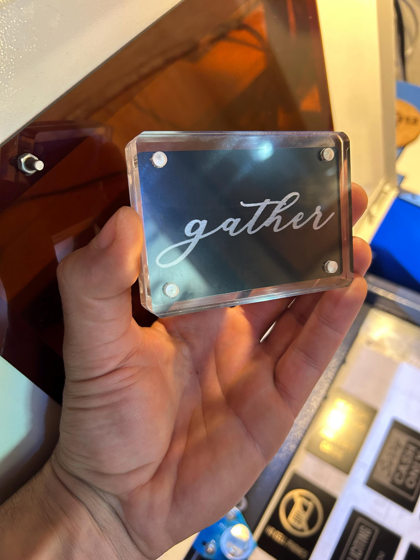 Hand holding a metal mini placard with “gather” laser engraved on it – farmhouse style décor
