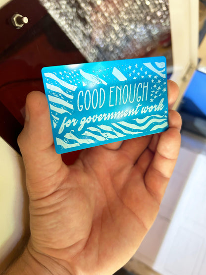Laser engraved metal gag gift card with "Good Enough For Government Work" text on American flag graphic, in blue/silver