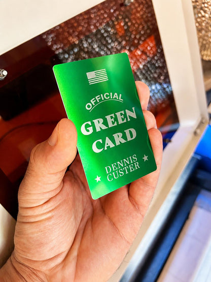Laser engraved metal green card gag gift layout with personalized name engraving in green/silver anodized aluminum