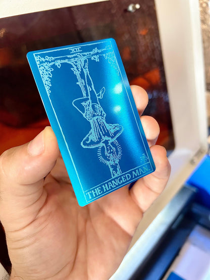 Laser engraved The Hanged Man metal tarot card in blue/silver anodized aluminum