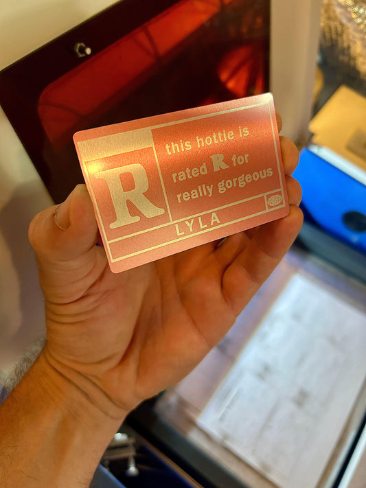 Cute laser engraved metal keepsake card with personalized name engraving that reads This Hottie is REALLY GORGEOUS Rated R in rose gold/silver anodized aluminum