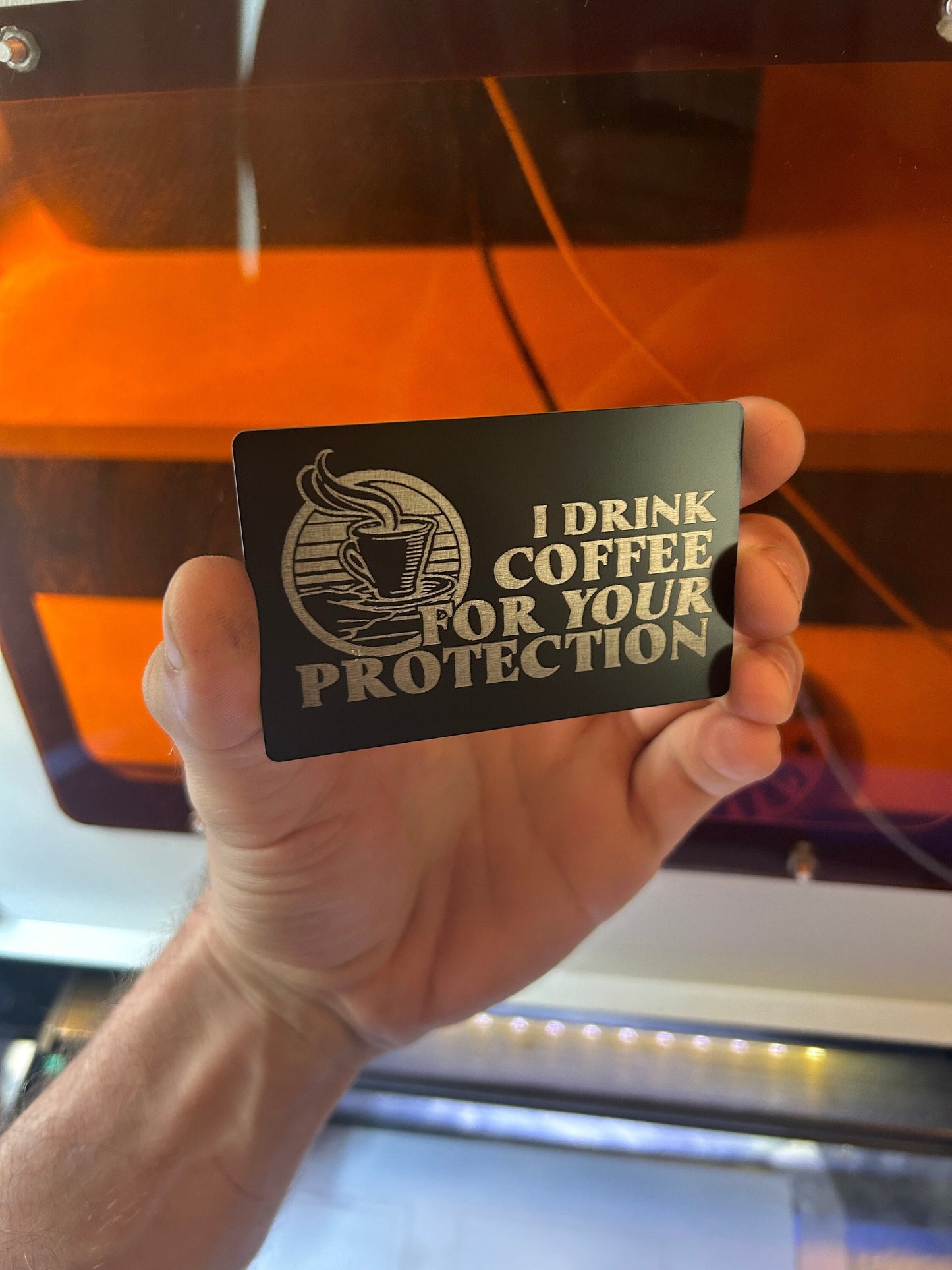 Metal novelty coffee lover keepsake card with I Drink Coffee text in black/silver anodized aluminum