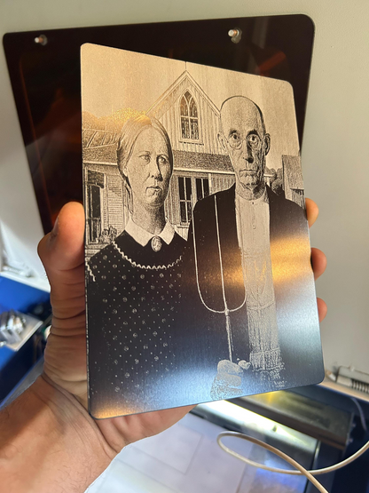 Hand holding creative commons American Gothic laser engraved decorative plaque in 5x7 anodized aluminum
