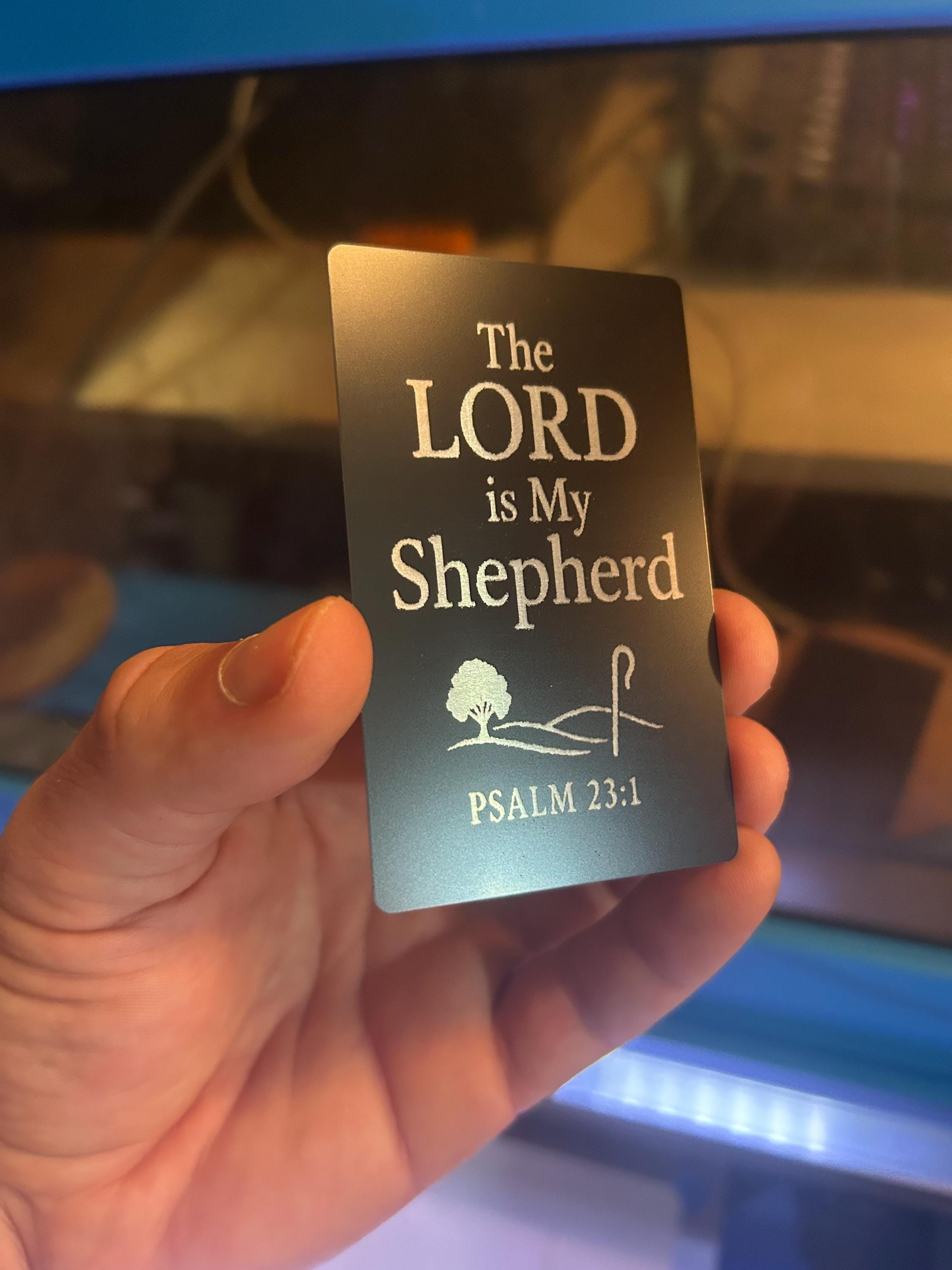 Close-up of engraved anodized aluminum Christian gift card featuring “The LORD is My Shepherd” scripture with Psalm 23:1 reference and shepherd graphic