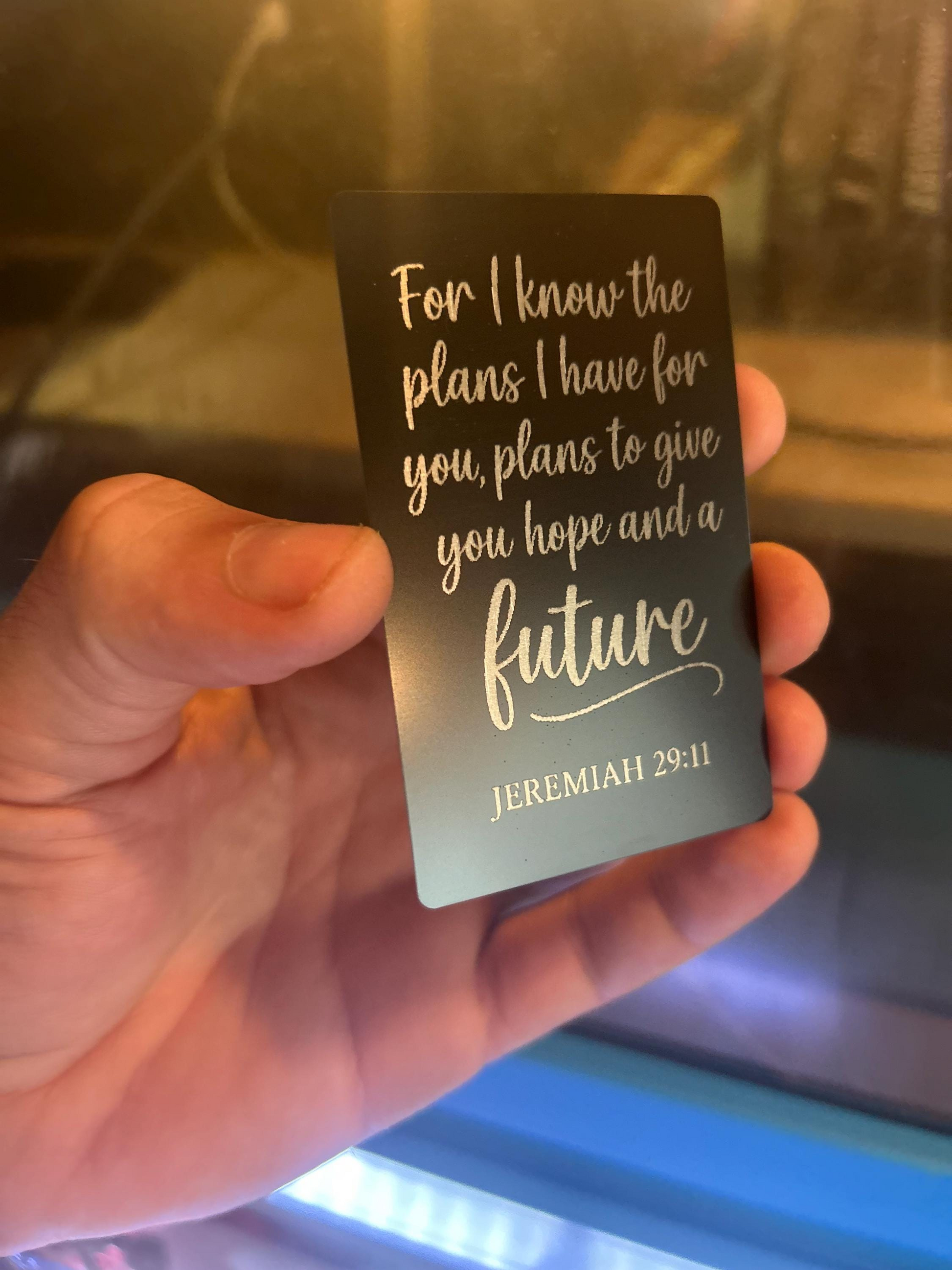 Close-up of engraved anodized aluminum Christian gift card featuring scripture “For I Know the Plans I Have For You” from Jeremiah 29:11