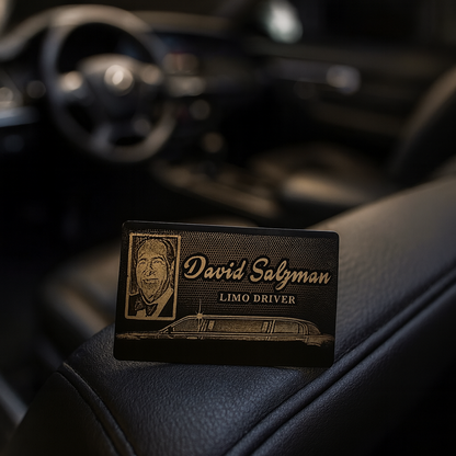 Metal laser engraved Limo driver badge on a car dashboard with a blurred car interior background