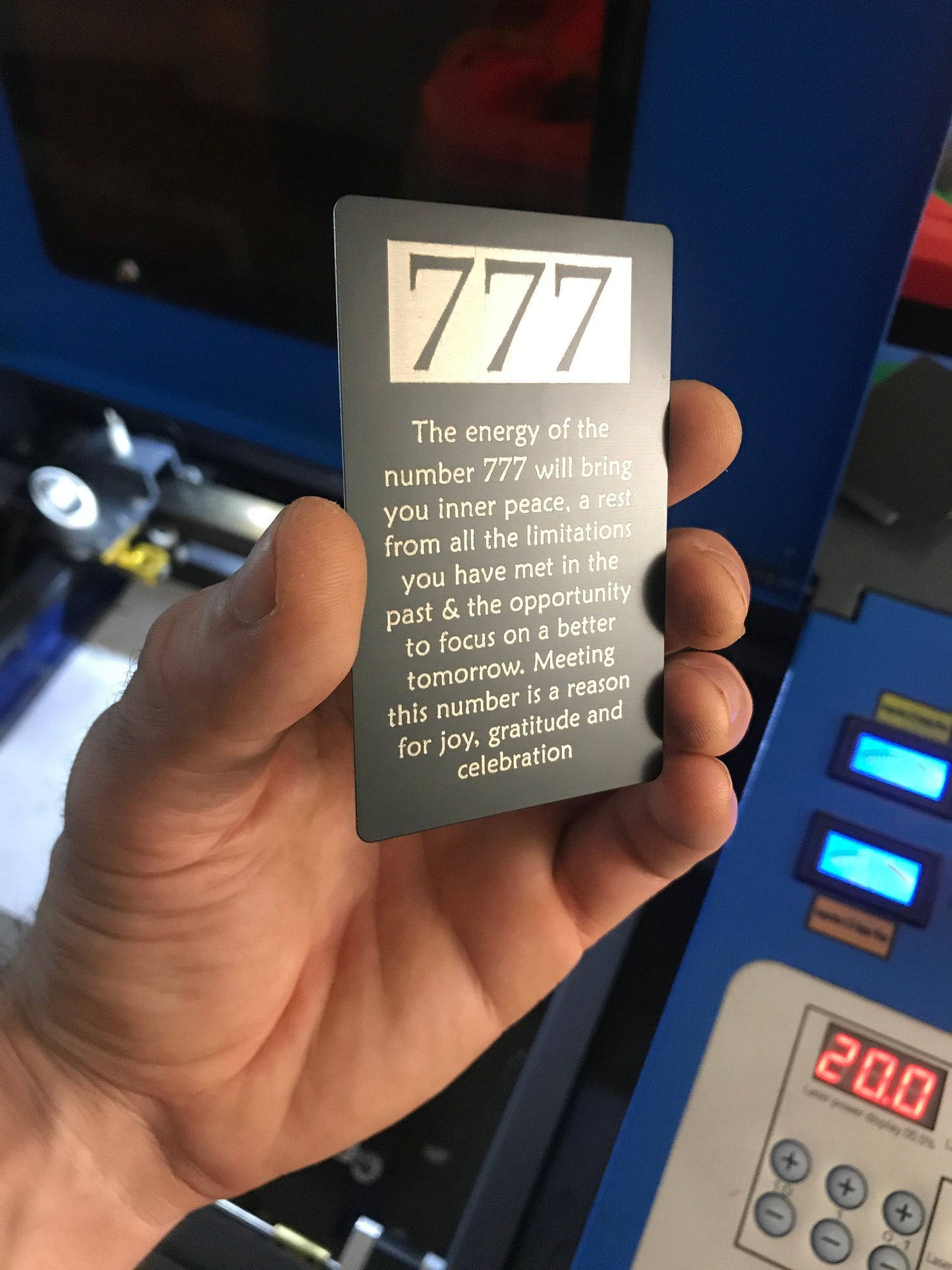 metal "777" text engraved on matte black/silver laser engraved keepsake card