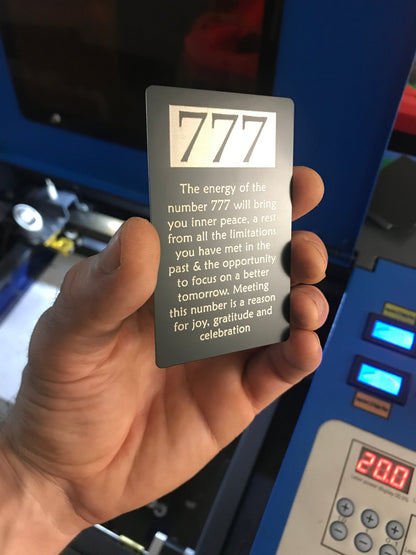 metal "777" text engraved on matte black/silver laser engraved keepsake card