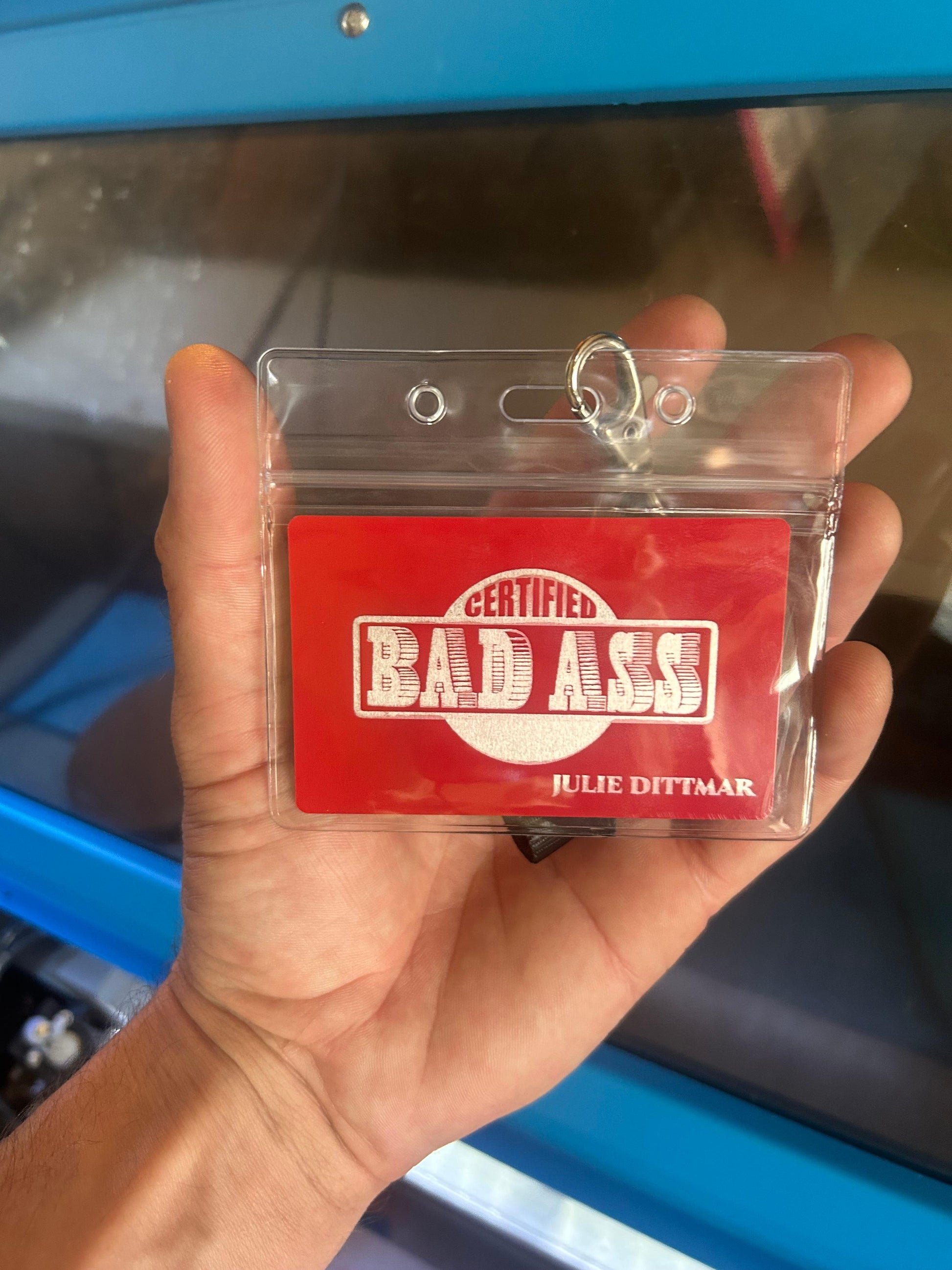 Metal bad ass certification badge in red/silver with personalized name engraving