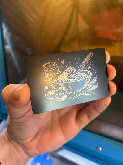 Laser engraved metal backing with flour and whisk