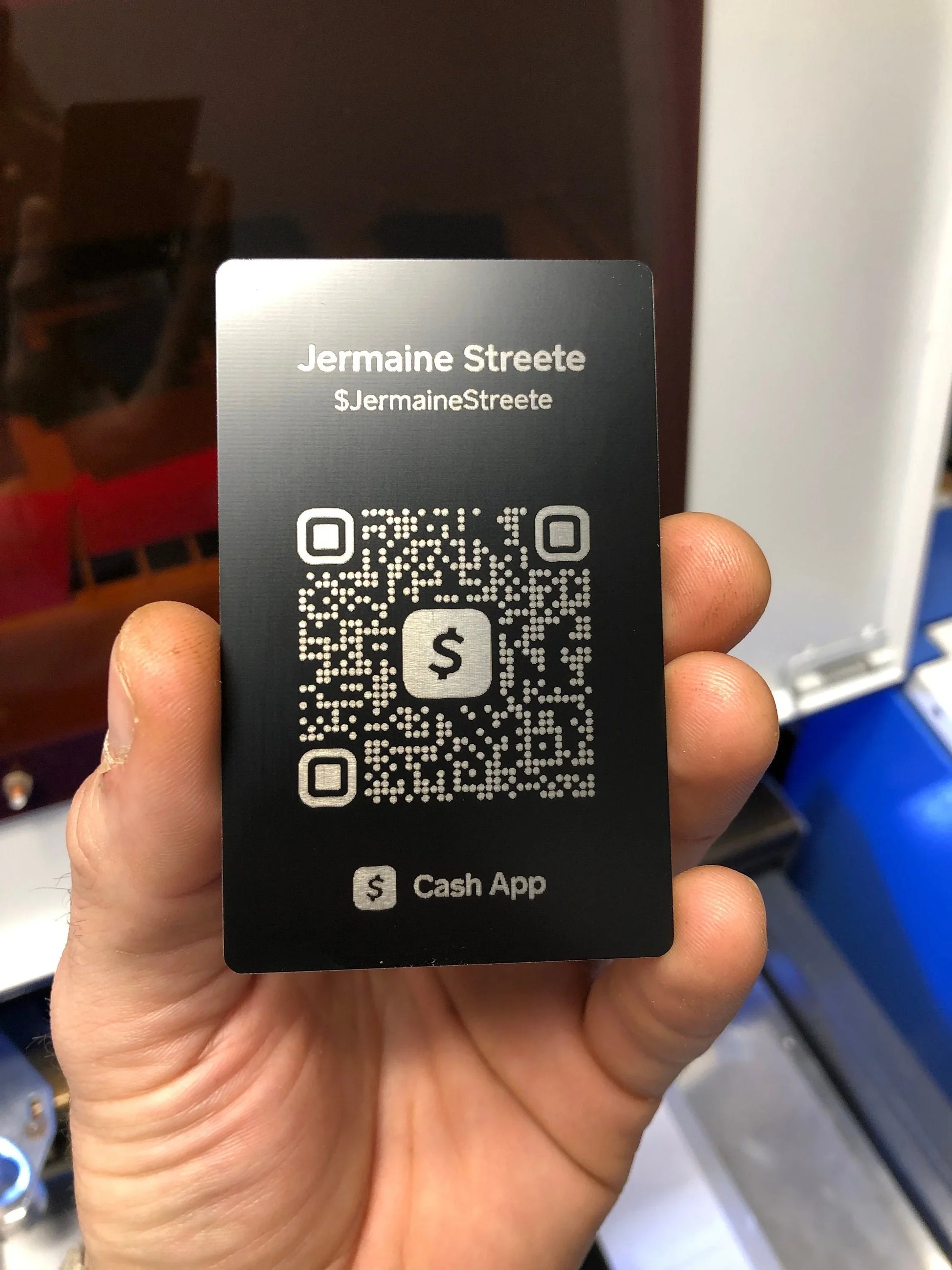 Laser engraved metal digital payment card with scannable Cash App QR code and user name