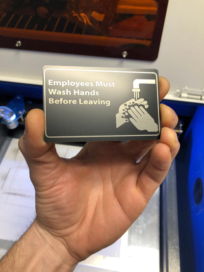 Metal "employees must wash hands" placard in black/silver