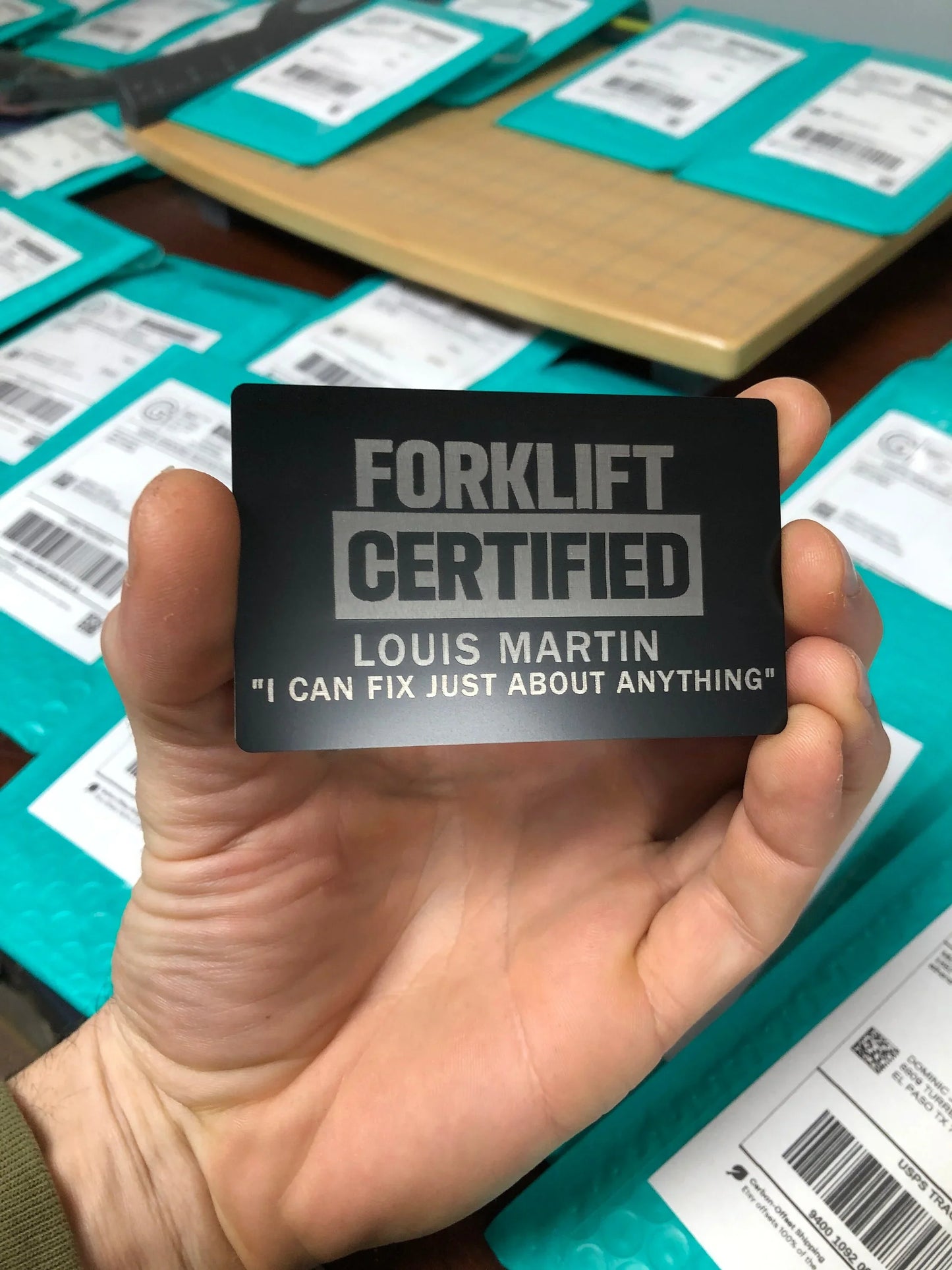 Forklift Certified metal gag gift card with personalized name and text laser engraved below in black/silver