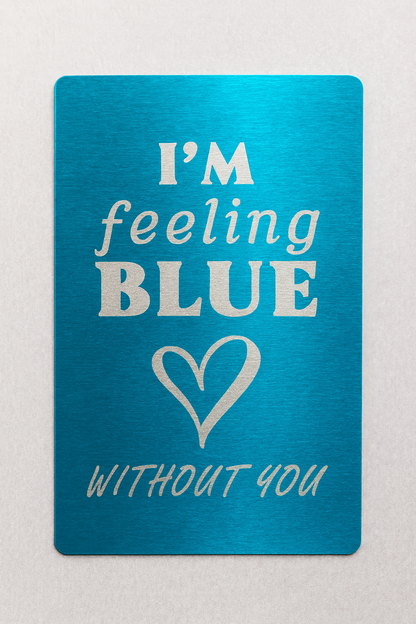 Blue card with silver text and heart symbol on a light gray background