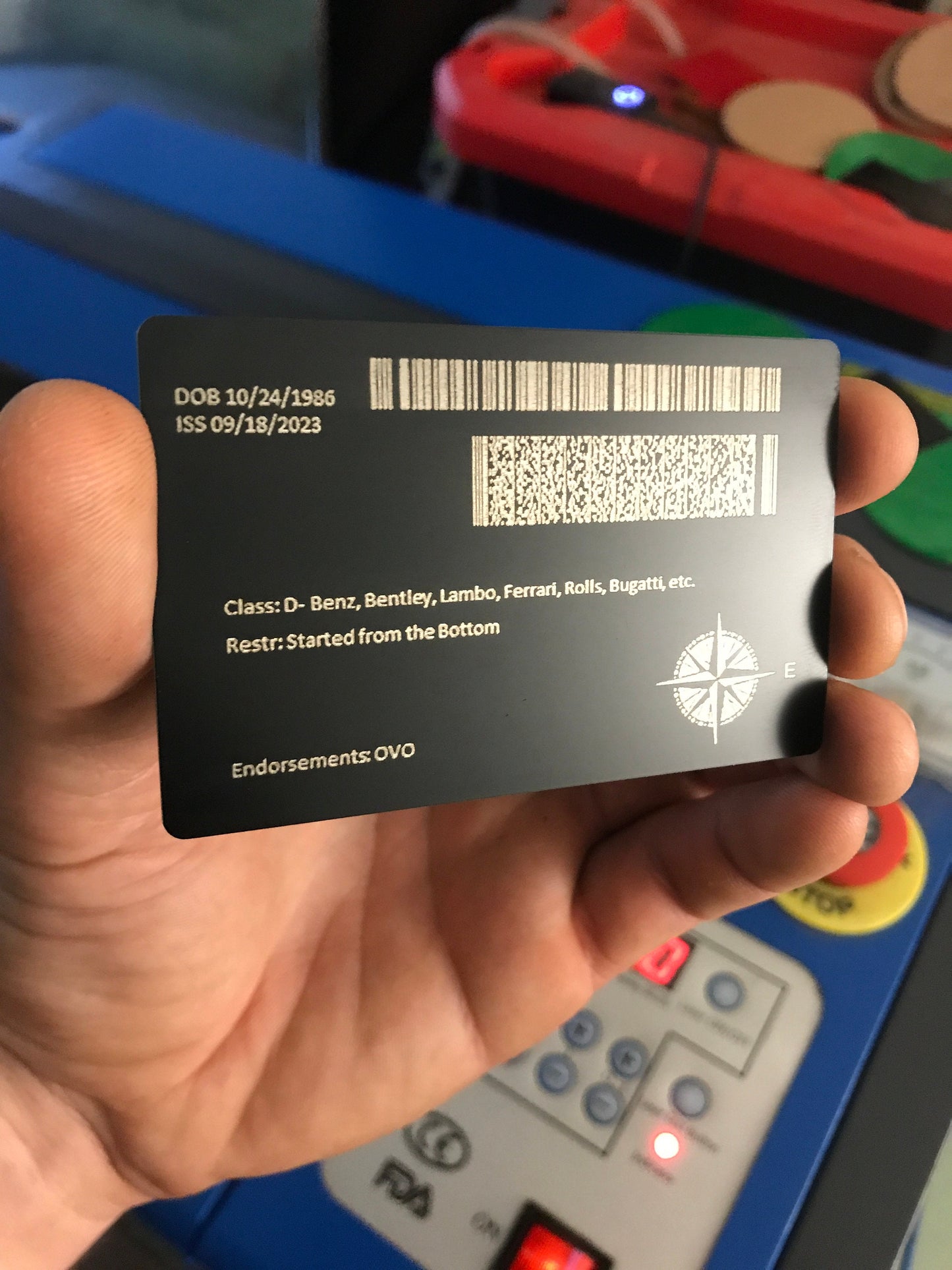 Laser engraved metal identification card with custom barcode and text