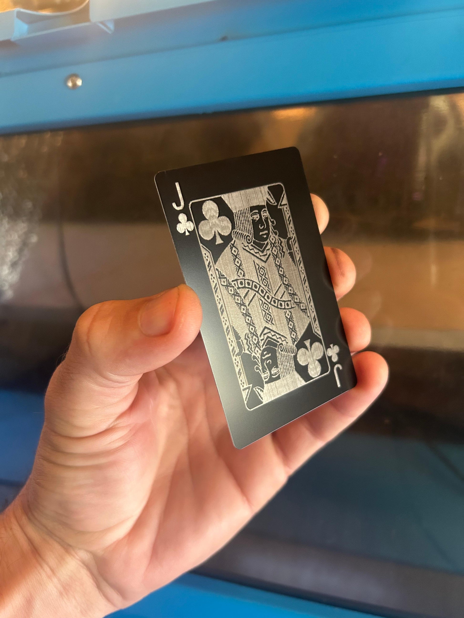 Metal poker card with Jack of Clubs engraving in black/silver