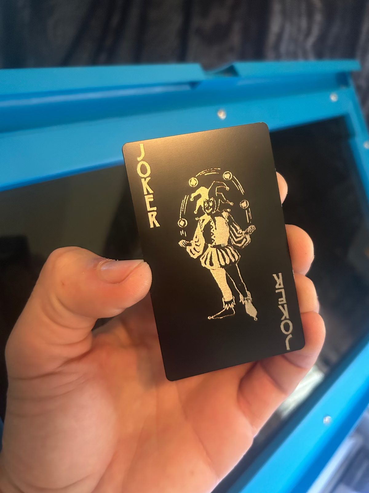Laser engraved metal joker playing card in black/silver