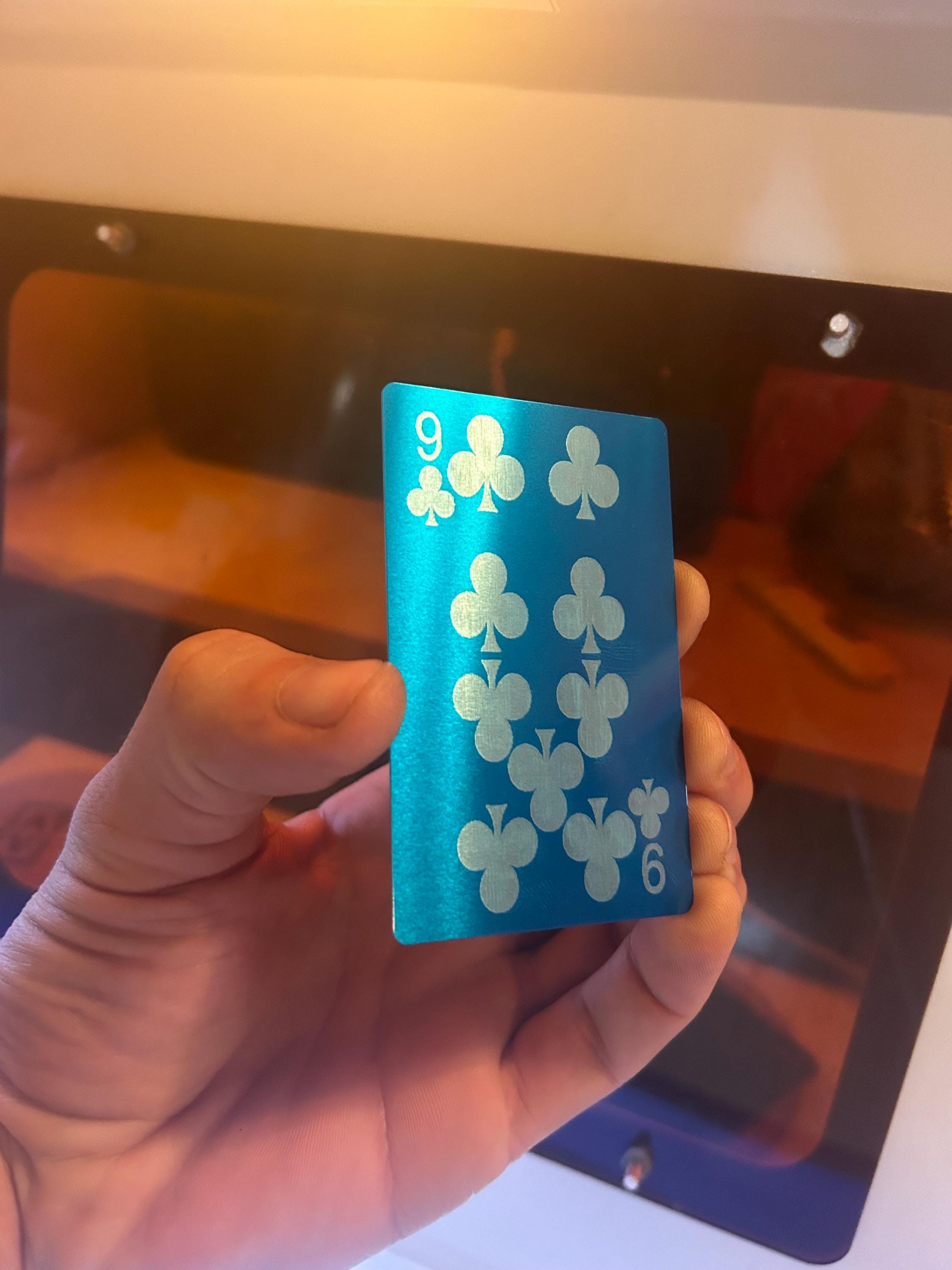 Metal laser engraved gaming gift with laser engraved poker card design