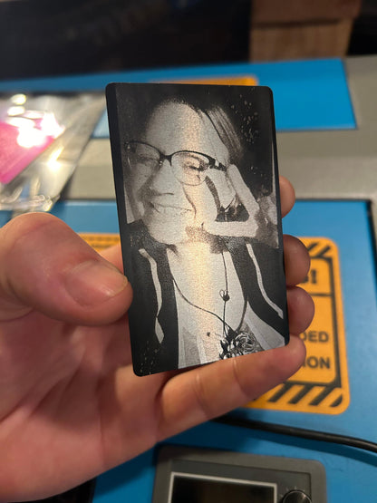 Laser engraved metal business card with portrait engraving in black/silver